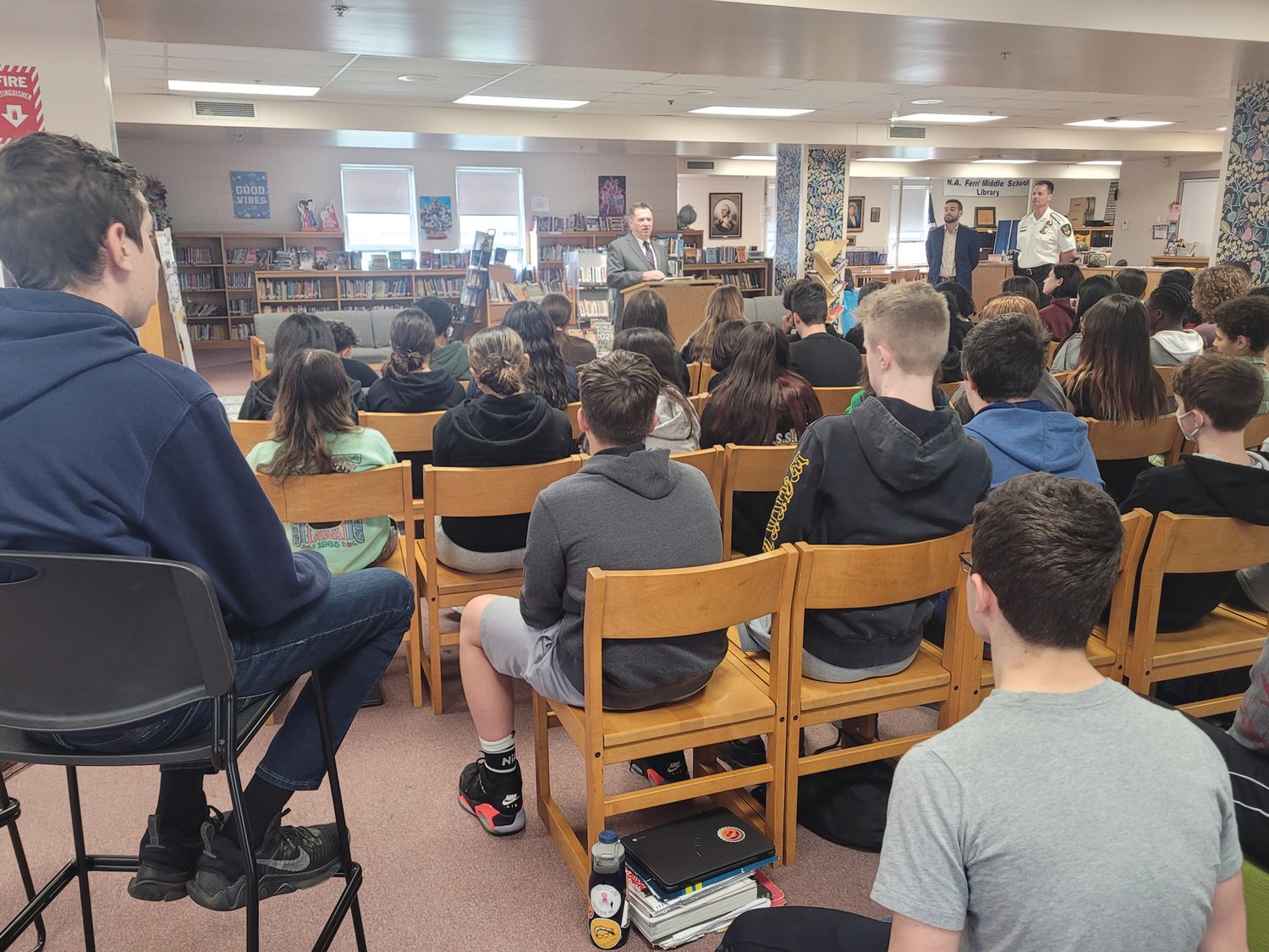 LAW DAY: Rhode Island Superior Court Associate Justice Joseph A. Montalbano, Johnston Town Council Vice President and mayoral candidate Joseph Polisena Jr., and Johnston Police Chief Joseph P. Razza stood in the Nicholas A. Ferri Middle School Library, facing a large group of civics students on Law Day last month. 